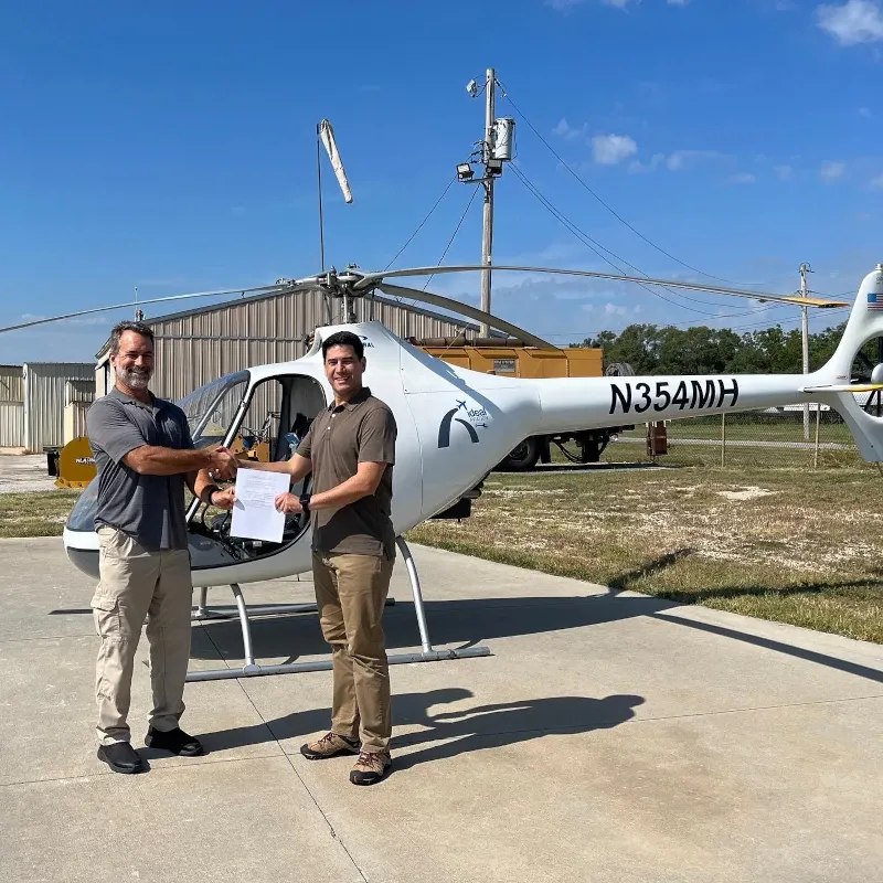 Student pilot receiving accreditation for his helicopter rating