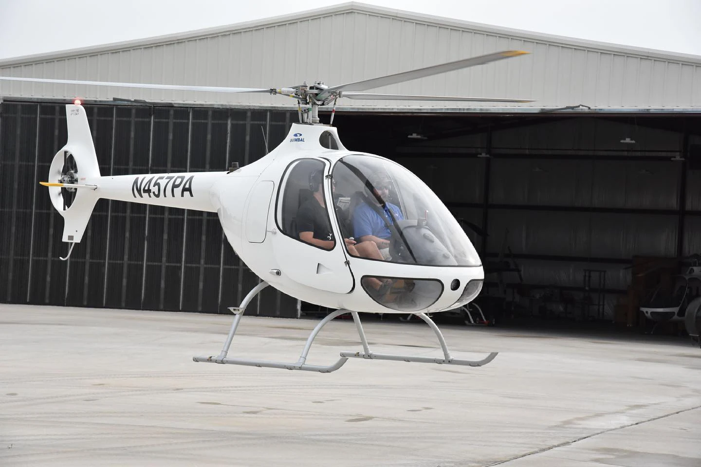 Helicopter hovering outside Ideal Aviation hangar