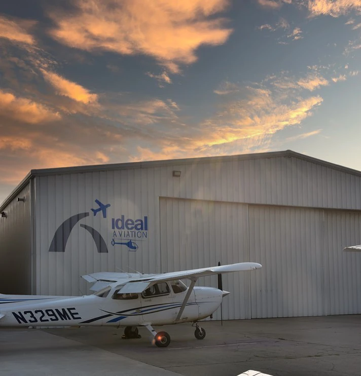 Cessna 172 Outside the Ideal Aviation Hangar During Sunset